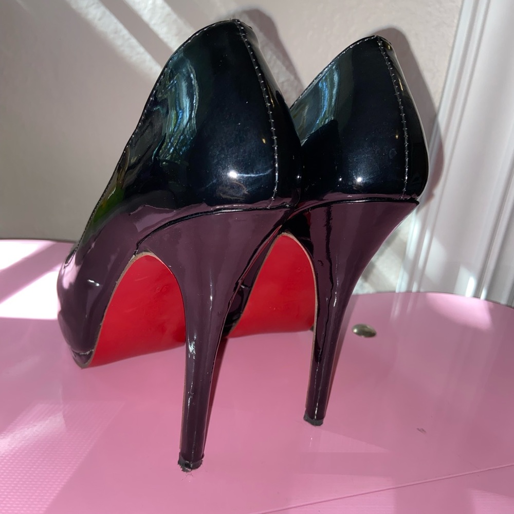 Black patent peep toe pumps. 150mm